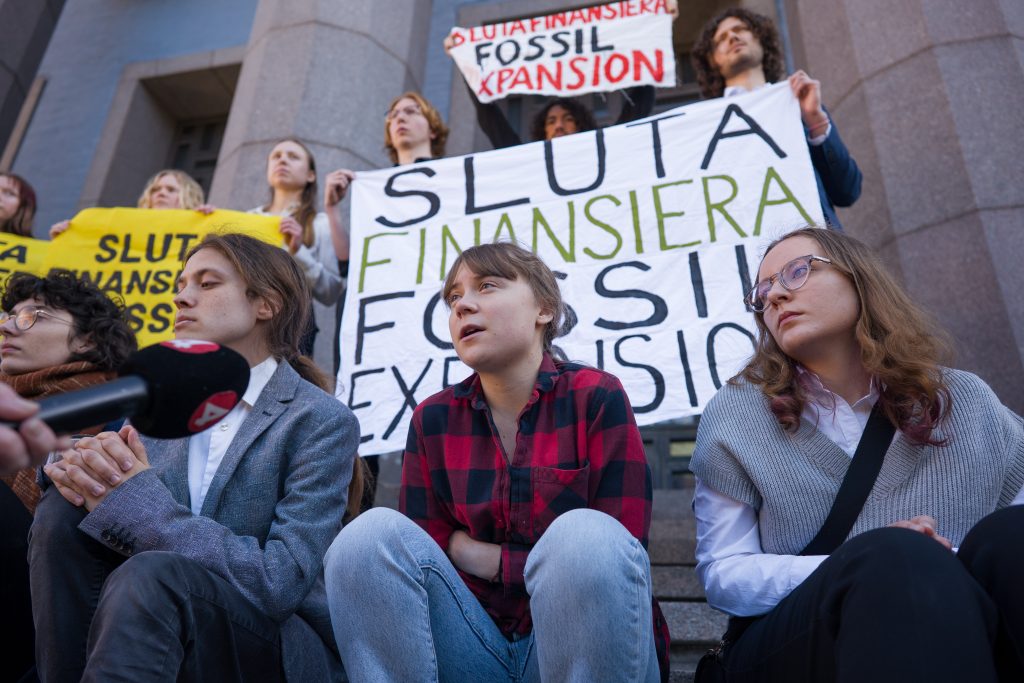 Activists sitting with banners